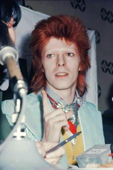 Bowie with light blue jacket, Ziggy era