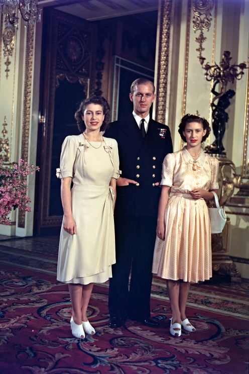 Princess Elizabeth (later Queen Elizabeth II) and her betrothed, Lieutenant Philip Mountbatten (later Duke of Edinburgh) pose together with Princess Margaret (1930-2002) at Buckingham Palace in London after announcing their engagement on 10th July 1947. (Photo by Rolls Press/Popperfoto/Getty Images)